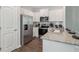 Galley kitchen with granite counters, stainless appliances, and white cabinets at 2286 Jamin Bnd # 19, Lithonia, GA 30058