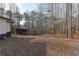 View of the backyard, storage building, and wooded area, creating a private outdoor space at 4289 Post Rd, Winston, GA 30187