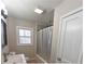 Bright bathroom featuring a shower-tub combo and modern vanity at 4289 Post Rd, Winston, GA 30187