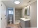 Well-lit bathroom with a walk-in shower, modern sink, and neutral color scheme at 4289 Post Rd, Winston, GA 30187