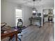Open dining room with views of the kitchen and backyard at 4289 Post Rd, Winston, GA 30187