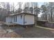 View of home's exterior, back yard and outbuilding at 4289 Post Rd, Winston, GA 30187