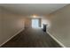 Cozy living room featuring a fireplace, neutral-colored walls, and a sliding glass door for easy access to the outside at 5073 Martins Crossing Rd, Stone Mountain, GA 30088