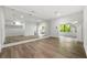 Spacious home gym features light wood floors, a full wall mirror, recessed lighting, and an open doorway to the staircase at 600 Colebrook Ct, Atlanta, GA 30327