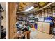 Unfinished basement with exposed ceiling, concrete floor, stored items, and a weight-lifting station at 635 Piping Rock Pt, Lawrenceville, GA 30043