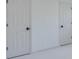 This is a photo of two white doors with black knobs at 80 Connemara Rd, Roswell, GA 30075