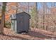 Small shed in wooded lot at 80 Connemara Rd, Roswell, GA 30075