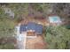 Aerial view of the property featuring a swimming pool and a driveway at 1106 Oak Sw Rd, Lilburn, GA 30047