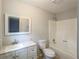 A clean bathroom featuring modern sink and vanity, a toilet, and a shower/tub combo for added functionality at 1106 Oak Sw Rd, Lilburn, GA 30047