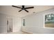 Bedroom featuring wood-look floors, a ceiling fan and an ensuite bathroom with a toilet and sink at 1106 Oak Sw Rd, Lilburn, GA 30047