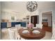 Dining room with a round table and a modern lighting fixture at 1106 Oak Sw Rd, Lilburn, GA 30047