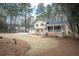 Charming two-story home with brick accents, front porch, and a large yard at 1106 Oak Sw Rd, Lilburn, GA 30047