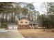 Charming two-story home with brick accents and a pool, surrounded by mature trees at 1106 Oak Sw Rd, Lilburn, GA 30047