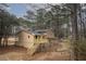 Charming home featuring a spacious deck, perfect for outdoor entertaining and relaxation amidst a serene wooded backdrop at 1106 Oak Sw Rd, Lilburn, GA 30047