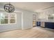 Kitchen with white and blue cabinets and stainless steel appliances at 1106 Oak Sw Rd, Lilburn, GA 30047