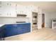 Kitchen with white and blue cabinets at 1106 Oak Sw Rd, Lilburn, GA 30047