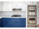 Kitchen featuring blue cabinets, stainless steel appliances and a gas cooktop at 1106 Oak Sw Rd, Lilburn, GA 30047