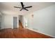 Living room with hardwood floors and stairs leading to the second floor at 1106 Oak Sw Rd, Lilburn, GA 30047