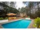 Outdoor pool next to a well-maintained lawn, perfect for relaxation at 1106 Oak Sw Rd, Lilburn, GA 30047