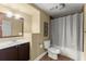 Bathroom with shower, dark cabinets, and brown floor at 1211 Comet View Se Trl, Smyrna, GA 30082