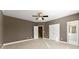 View of bedroom with neutral carpet and trim adjacent to the bathroom at 1211 Comet View Se Trl, Smyrna, GA 30082