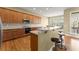 Stylish kitchen featuring stainless steel appliances, tiled backsplash, and center island at 1211 Comet View Se Trl, Smyrna, GA 30082