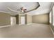 Spacious main bedroom showcasing neutral carpet, tray ceiling and natural light at 1211 Comet View Se Trl, Smyrna, GA 30082