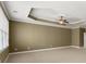 Spacious main bedroom featuring tray ceiling, carpeting and large windows at 1211 Comet View Se Trl, Smyrna, GA 30082