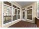 Covered porch with wood floors and views of the backyard at 1211 Comet View Se Trl, Smyrna, GA 30082