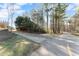 A sunny street view in a wooded neighborhood at 1211 Comet View Se Trl, Smyrna, GA 30082