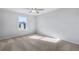 Bedroom featuring neutral carpet, a ceiling fan, and a window with a nice view at 517 Elkwood Ln, Mcdonough, GA 30253