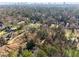 Aerial view revealing large lots interspersed with mature trees and neighboring properties at 3200 Wood Valley Nw Rd, Atlanta, GA 30327