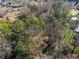 An aerial view of a secluded lot with mature trees and verdant landscaping at 3200 Wood Valley Nw Rd, Atlanta, GA 30327