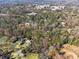 An aerial view of the neighborhood showcasing many mature trees and lush surroundings at 3200 Wood Valley Nw Rd, Atlanta, GA 30327