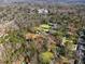 Expansive aerial shot revealing the property's generous lot with tennis court and neighborhood amenities at 3200 Wood Valley Nw Rd, Atlanta, GA 30327