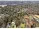 An aerial view of the property showcasing its lush surroundings, mature trees and great location at 3200 Wood Valley Nw Rd, Atlanta, GA 30327