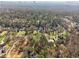 An aerial view of the property showcasing its location with mature trees and lush surroundings at 3200 Wood Valley Nw Rd, Atlanta, GA 30327