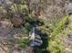 Aerial view featuring landscaped yard, mature trees, and circular drive at 3200 Wood Valley Nw Rd, Atlanta, GA 30327