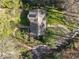 Aerial view showing a house with well-kept lawn, brick path, and mature trees on a sunny day at 3200 Wood Valley Nw Rd, Atlanta, GA 30327