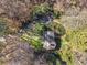 Aerial view showcasing the property's secluded location, long driveway, and mature landscaping at 3200 Wood Valley Nw Rd, Atlanta, GA 30327