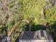 Aerial view showing the rear of a house with landscaping and a brick pathway at 3200 Wood Valley Nw Rd, Atlanta, GA 30327