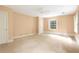 Inviting bedroom featuring neutral carpet, ample closet space and a window for natural light at 3200 Wood Valley Nw Rd, Atlanta, GA 30327
