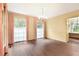 Dining room with hardwood floors, chandelier, and large windows with views of the backyard at 3200 Wood Valley Nw Rd, Atlanta, GA 30327