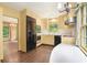 Bright eat in kitchen with chandelier, stainless appliances, and a breakfast nook with large sunny windows at 3200 Wood Valley Nw Rd, Atlanta, GA 30327
