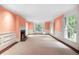 Bright living room with a fireplace, large windows, and decorative trim at 3200 Wood Valley Nw Rd, Atlanta, GA 30327