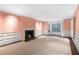 Bright living room with a fireplace, large windows, and decorative trim at 3200 Wood Valley Nw Rd, Atlanta, GA 30327