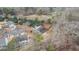 Aerial view of the home showcasing the roof, landscaping, and surrounding trees at 1315 Thunder Gulch Pass, Suwanee, GA 30024