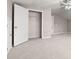 Empty bedroom features carpet, and open closet with ample space at 1315 Thunder Gulch Pass, Suwanee, GA 30024