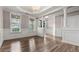 Elegant dining room featuring hardwood floors, white columns, and ample natural light at 1315 Thunder Gulch Pass, Suwanee, GA 30024