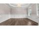 Elegant dining room featuring hardwood floors, decorative chandelier and panel molding at 1315 Thunder Gulch Pass, Suwanee, GA 30024